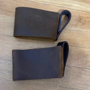 Two mug holders from Portland leather goods